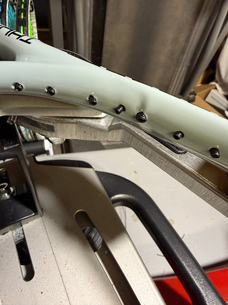 When Is a Tennis Racquet Not Worth Restringing?
